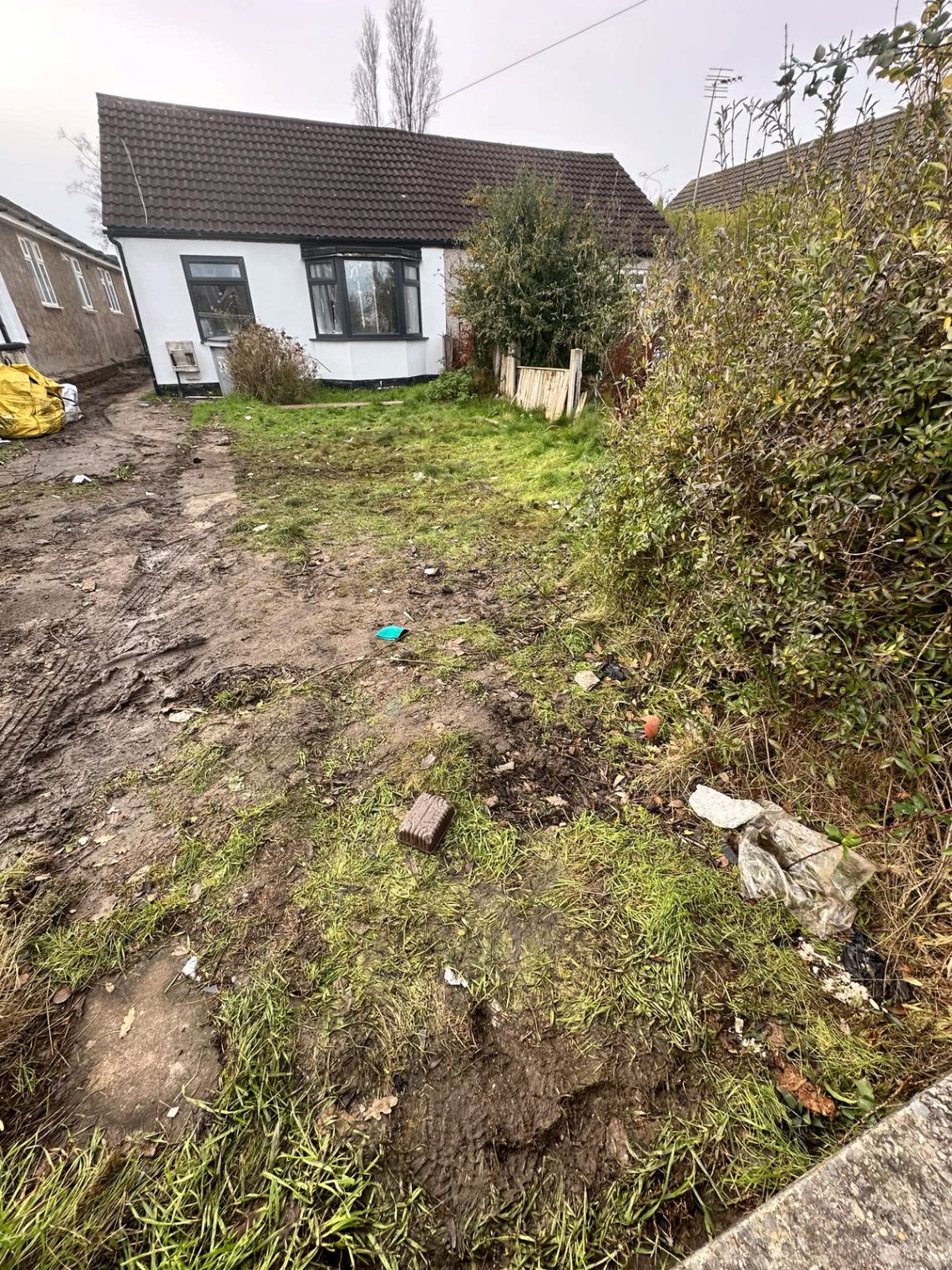 After clearance: front garden cleared of all debris with the property frontage fully visible again