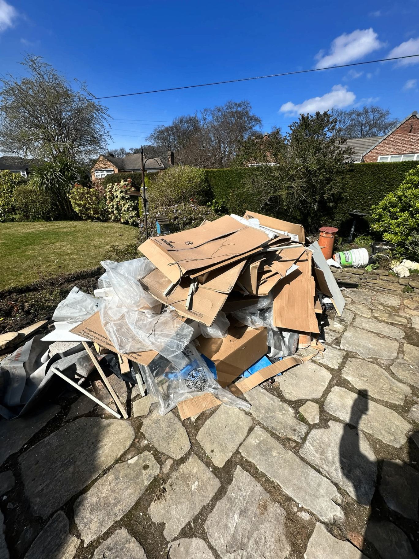 Cleared garden and patio after a builders' strip-out and site clearance on the Wirral